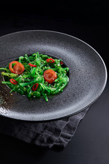 Chuk salad on a black plate