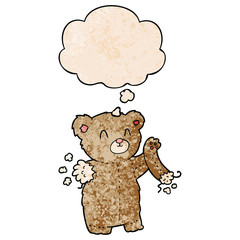 cartoon teddy bear with torn arm and thought bubble in grunge texture pattern style
