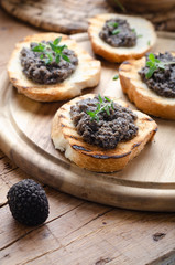 Bruschetta with black truffle ,salsa tartufata.