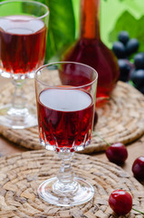 Ratafia - tipical Italian sweet alcoholic beverage, either a fruit-based beverage or a fortified wine with cherries. Rustic style.