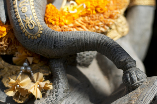 Close up picture of a Ganesha statue's trunk