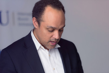 African american business coach gives presentation for business people, multiracial and multiethnic business peoople at conference meeting room.