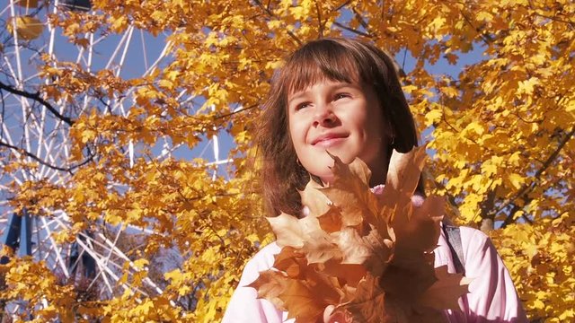 Child Holding Leaf Boquet. Happy Girl With Autumn Leaves.