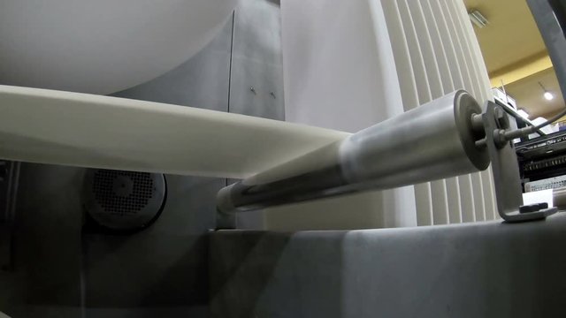 Rollers view. Print press roll paper goes through the rollers for newspaper printing webset production line