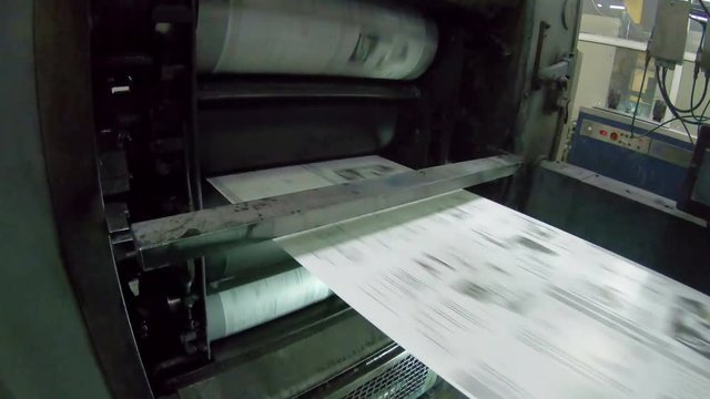 Newspapers Offset Web Printing units and roll of paper moving fast