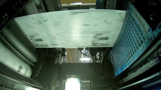 Web set offset print shop newspapers Printing, Newspapers coming off the rotation printing press industrial machine