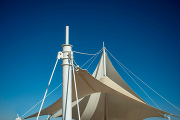 The white arbor was set against a blue sky