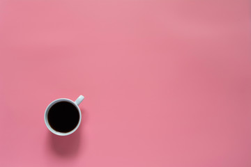 Top view of coffee on pink background and copy space for insert text.