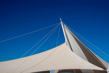 The white arbor was set against a blue sky
