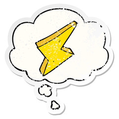 cartoon lightning and thought bubble as a distressed worn sticker
