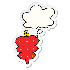 cartoon christmas decoration and thought bubble as a printed sticker