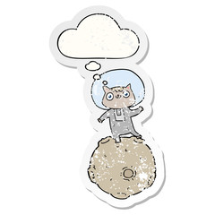 cute cartoon astronaut cat and thought bubble as a distressed worn sticker