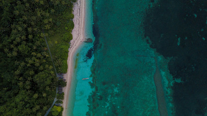 Beautiful aerial view of blue ocean beside beach