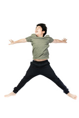 Portrait of happy little Asian child jumping isolated on white