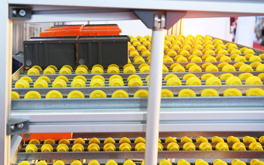 Plastic boxes on the roller conveyor. Modern warehouse equipment.