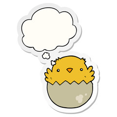 cartoon chick hatching from egg and thought bubble as a printed sticker