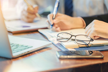 Thinking of eye concept. Businessman meeting to discuss the situation on the market. Analyzing business data. Selected focus at glasses