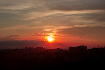 Sunrise over modern office buildings in business district center.