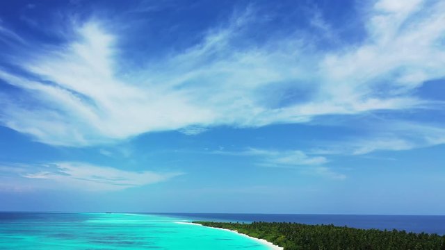 Flight over desert island with  palm trees, white sand beach and crystal clear turquoise  water of Saona, Dominican Republic