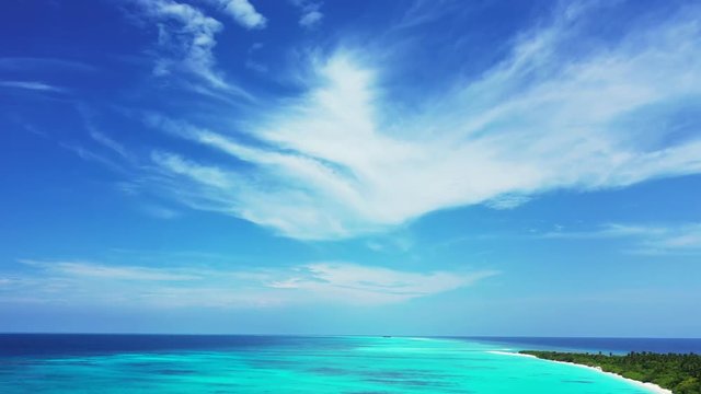 aerial drone shot of crystal clear emerald see and Uncontaminated coastline of tropical Caribbean Coral Reef Atoll