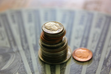 American coins on blur bank note