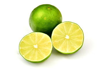 Obraz na płótnie Canvas Fresh green lime cut in half isolated on white background.
