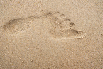 Fototapeta na wymiar footprint on the beach sand.