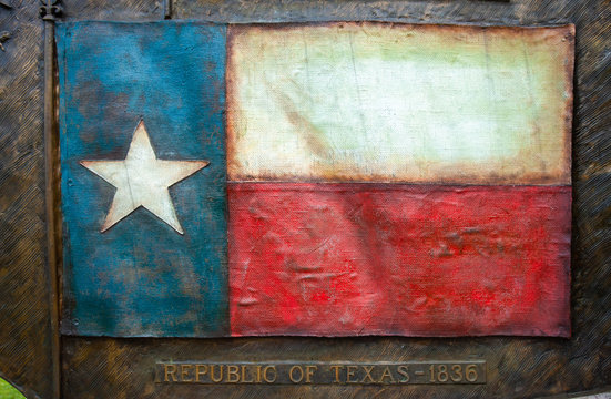 Flag of Texas on memorial plate with the date of 1836, when Texas declared idependence from Mexico