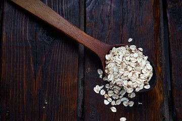 oat flakes in a wooden spoon