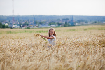 girl running on a wheat field