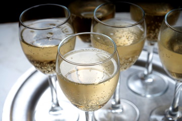 glasses with sparkling wine on a metal dressing