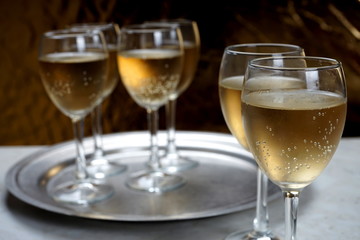 glasses with sparkling wine on a metal dressing