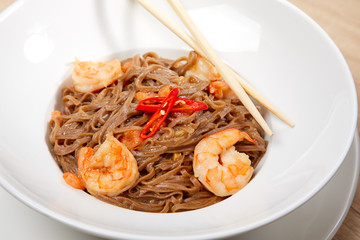 noodle with shrimps on wooden table