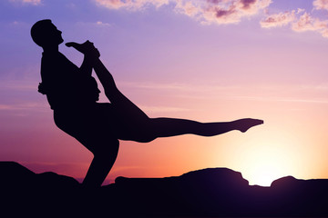 Acro yoga at sunrise concept
