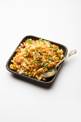 Bhelpuri Chaat/chat is a road side tasty food from India, served in a bowl or plate. selective focus