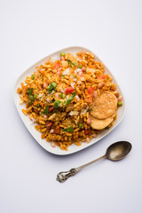 Bhelpuri Chaat/chat is a road side tasty food from India, served in a bowl or plate. selective focus