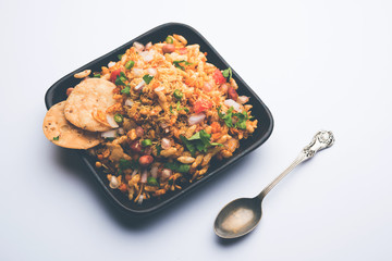 Bhelpuri Chaat/chat is a road side tasty food from India, served in a bowl or plate. selective focus