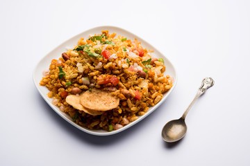 Bhelpuri Chaat/chat is a road side tasty food from India, served in a bowl or plate. selective focus
