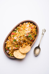 Bhelpuri Chaat/chat is a road side tasty food from India, served in a bowl or plate. selective focus