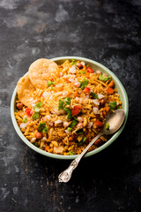 Bhelpuri Chaat/chat is a road side tasty food from India, served in a bowl or plate. selective focus