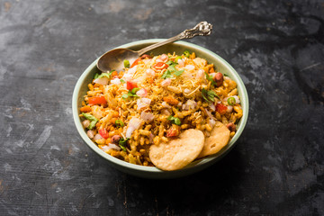 Bhelpuri Chaat/chat is a road side tasty food from India, served in a bowl or plate. selective focus