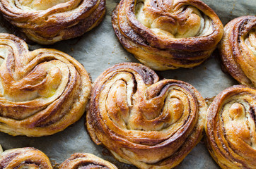 Baked fresh fragrant cinnamon buns. Traditional homemade pastries.