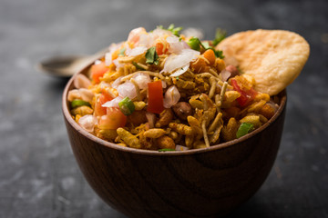Bhelpuri Chaat/chat is a road side tasty food from India, served in a bowl or plate. selective focus