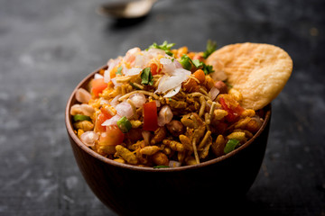 Bhelpuri Chaat/chat is a road side tasty food from India, served in a bowl or plate. selective focus