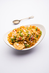 Bhelpuri Chaat/chat is a road side tasty food from India, served in a bowl or plate. selective focus