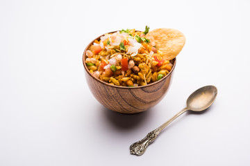 Bhelpuri Chaat/chat is a road side tasty food from India, served in a bowl or plate. selective focus