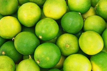 Fresh ripe limes as background