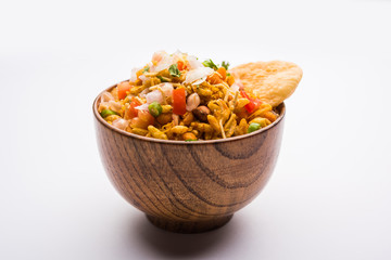 Bhelpuri Chaat/chat is a road side tasty food from India, served in a bowl or plate. selective focus
