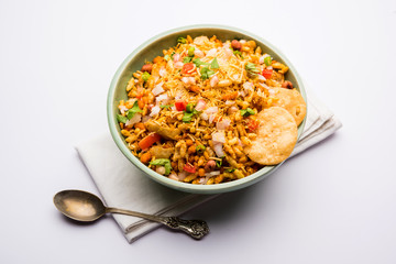 Bhelpuri Chaat/chat is a road side tasty food from India, served in a bowl or plate. selective focus