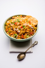Bhelpuri Chaat/chat is a road side tasty food from India, served in a bowl or plate. selective focus